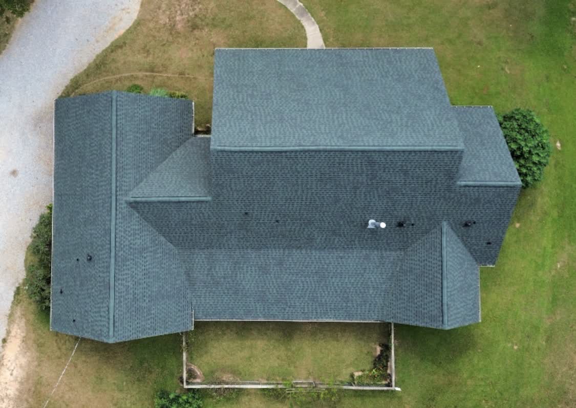 Top-down aerial view of an energy-efficient finished roof in Central Mississippi