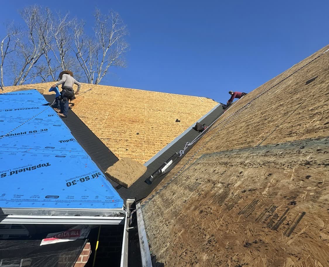 Roof repair in progress with new sheathing exposed on a Central Mississippi home