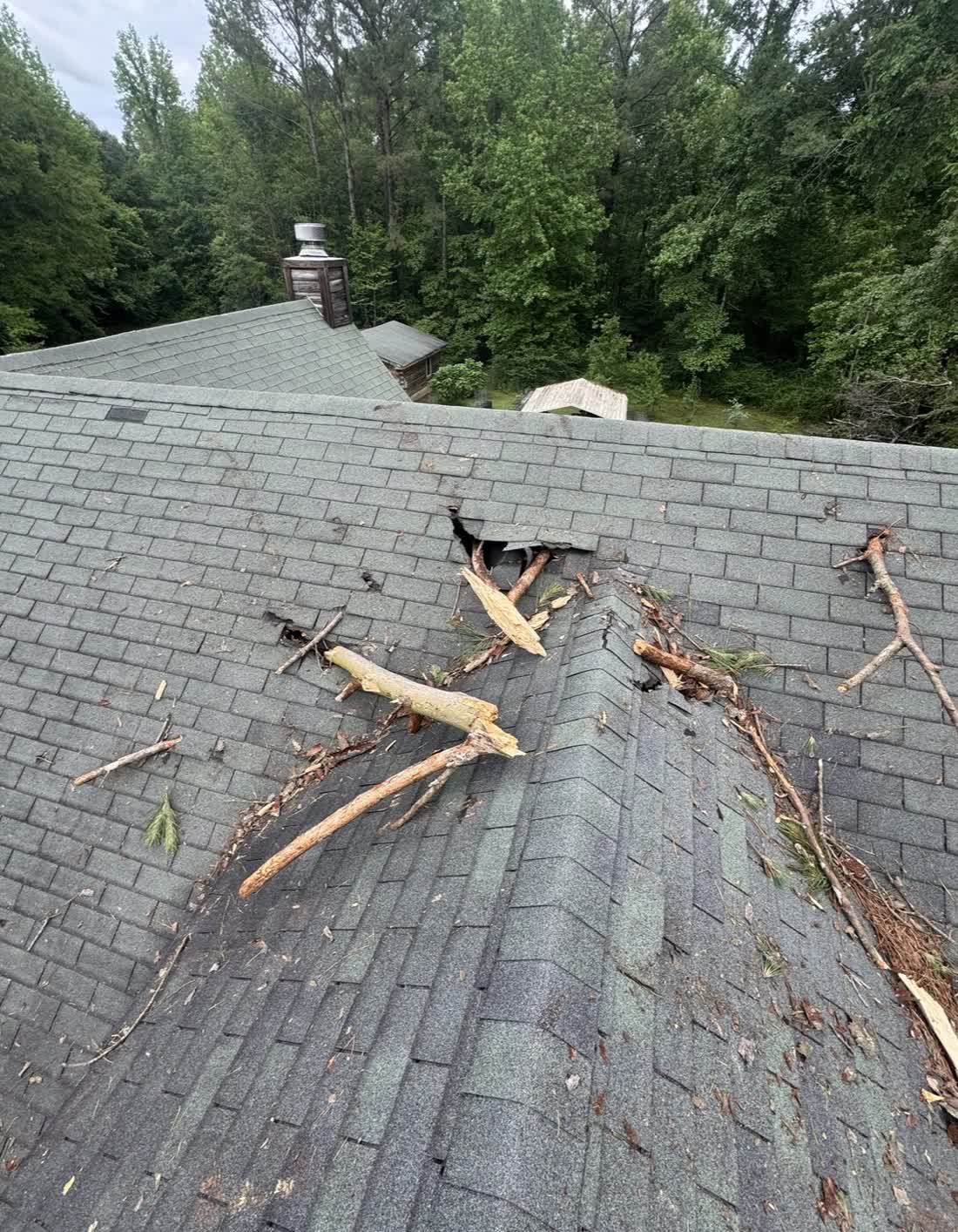 Severe storm damage to a Central Mississippi residential asphalt shingle roof